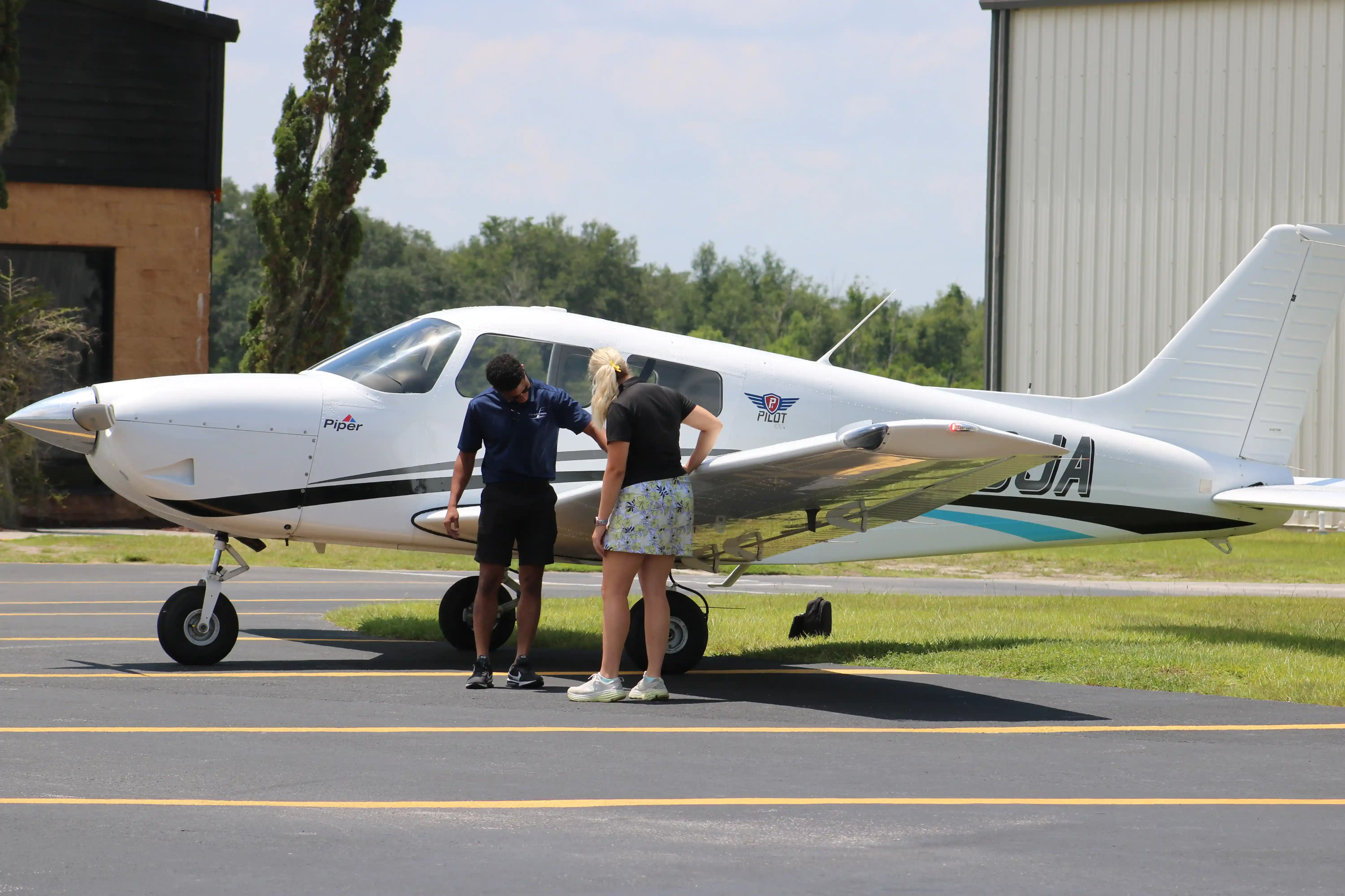 Instructor teaching student preflight